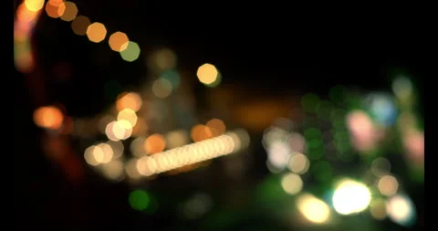Lights on street at midnight, Abstract light background particles.Movement flow Stock Footage 244598804