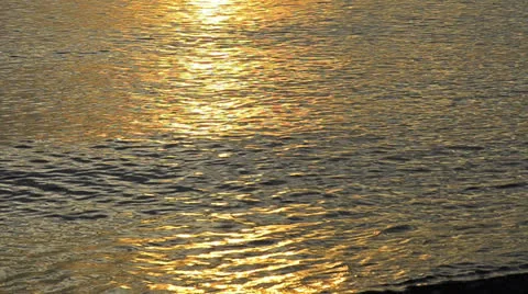 Lights of sunrise over an ocean. waves and orange color. with audio Stock Footage 23599852