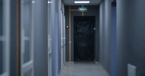 Lights turning off in an empty corridor Stock Footage