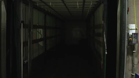 Lights turning on inside empty truck, lorry parked in warehouse dock ready Video stock 133747832