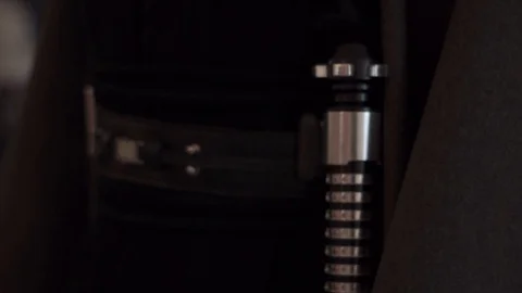 Lightsaber at belt Stock Footage 128596789