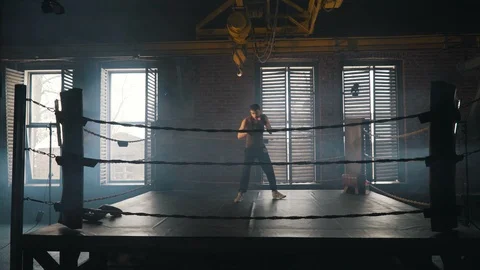 Lightweight boxer training hard on the ring in vintage stylized gym Stock Footage 87835009