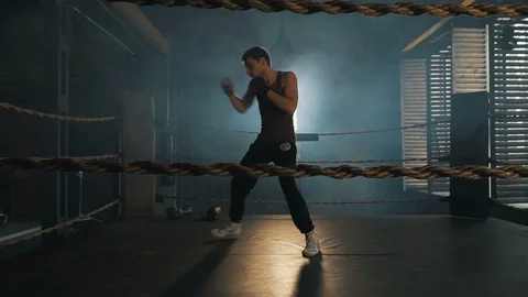 Lightweight boxer training on the ring in vintage stylized gym Stock Footage 87841665