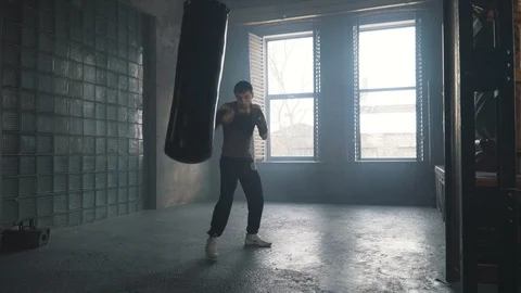 Lightweight boxer training in vintage stylized gym Stock Footage 87837055