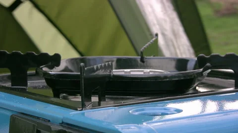 Lightweight Camping Kettle Is On A Lit Single Ring Butane Gas