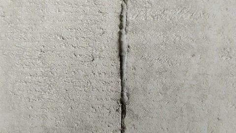 Lightweight concrete block wall with untidy mortar joints Stock Footage 314930564