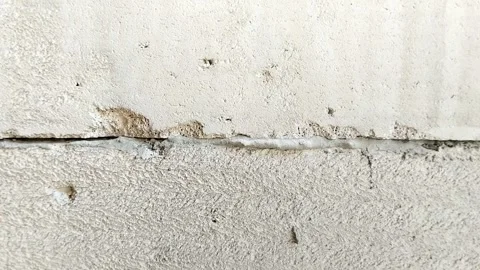 Lightweight concrete block wall with untidy mortar joints Stock Footage 314931546
