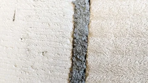 Lightweight concrete block wall with untidy mortar joints Stock Footage 314931582