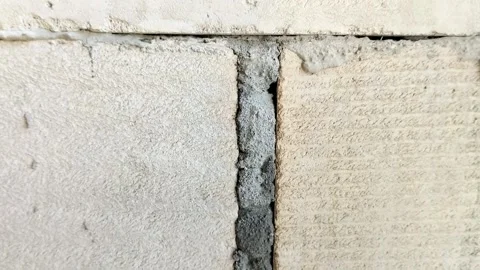 Lightweight concrete block wall with untidy mortar joints Stock Footage 314931592