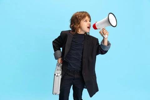 Liitle cute boy, kid in image of stylish hairdresser, barber shouting at 写真素材