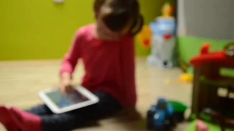 Liittle girl using tablet pc, blur Stock Footage 41462132