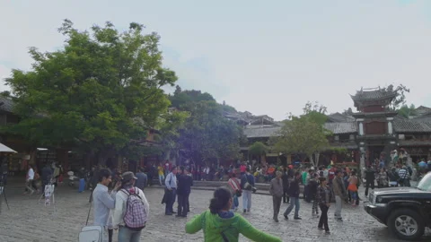 Lijiang Old Town Square is the distribution centre for tourists Stock Footage 148336410