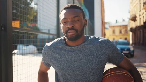 Likable African guy getting mobile phone from pocket, looking at screen Stock Footage 92054871
