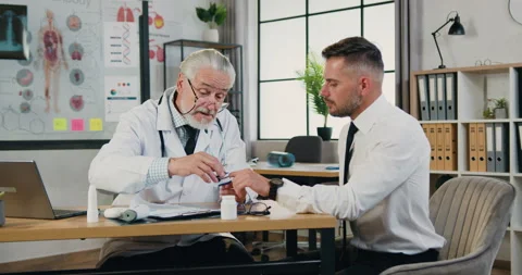 Likable confident bearded 40-aged businessman visiting medical office where Stock Footage 160833652