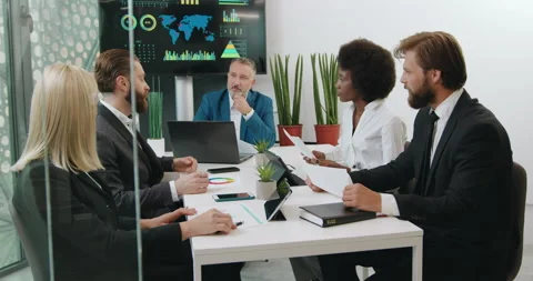 Likable confident stylish high-skilled group of people working together in Stock Footage 141820776