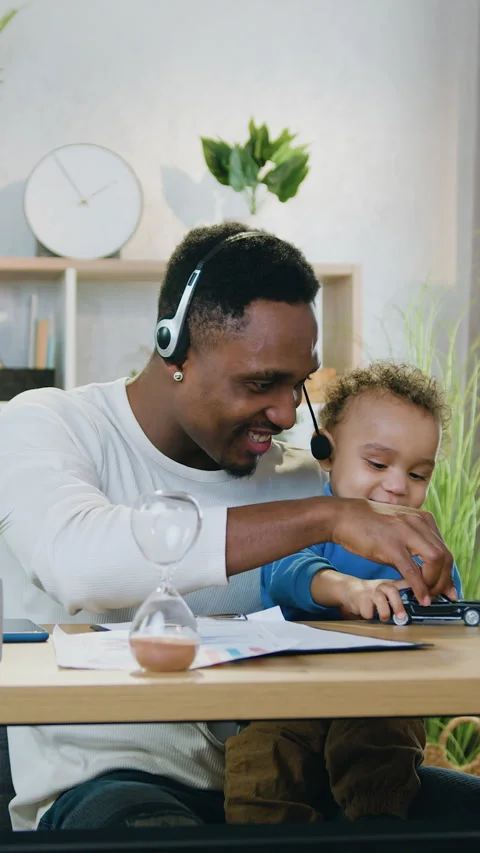 Likable joyful caring 30-aged african american dad in headphones having fun toge Stock Footage 329436920