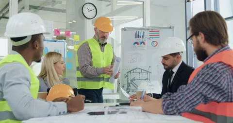Likable professional confident experienced multiracial team of engineers and Stock Footage 145812440