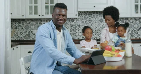 Likable satisfied cheerful 35-aged black-skinned man looking at camera with Stock Footage 144260047