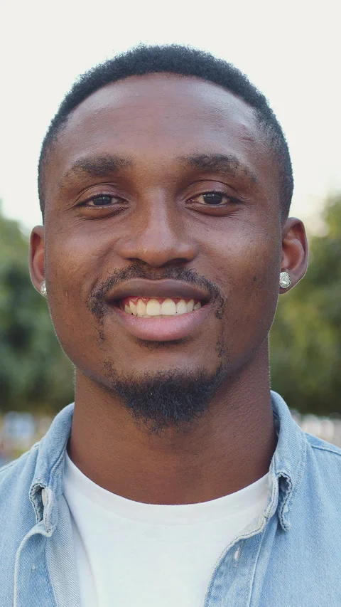 Likable smiling happy 25-30-aged modern dark-skinned guy with well-maintained be Stock Footage 325107029