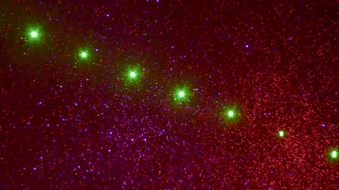 On a lilac and red changing gradient background, moving multi-colored figures Stock Footage 244738598