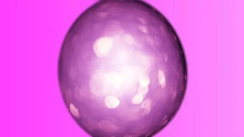 Lilac animated Easter egg on a purple background. Bright easter background. Stock Footage 104959960