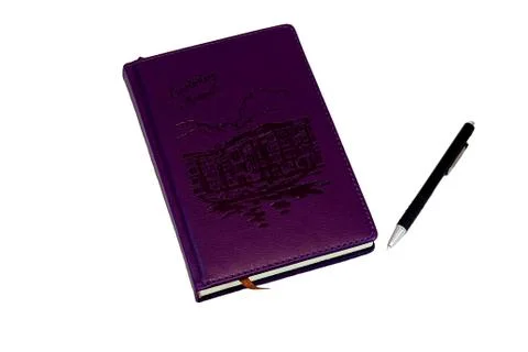 Lilac on white background notebook, which lies near black red pen to write it Stock Photos