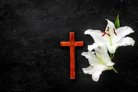 Lily funeral flower with cross. Condolence card with copy space Stock Photos