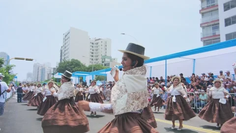 Lima, Peru. 1 March 2026; Peruvian women dancing in an andean carnival parade Stock Footage 330255503