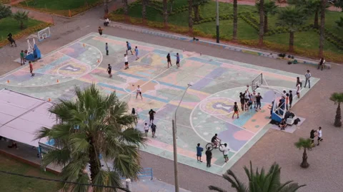 Lima, Peru – 2024/1/4: Groups playing on outdoor basketball court Stock Footage 277225048
