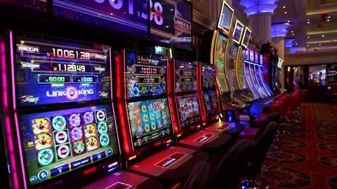 Lima, Peru, March 04, 2026: Row of slot machines with neon lights in casino 库存影片 332511252