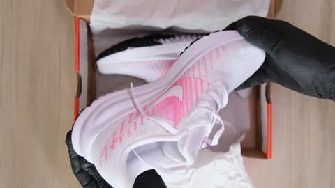 Lima, Peru. March 07 2026; Person unboxing new nike running shoes Stock Footage 330592898
