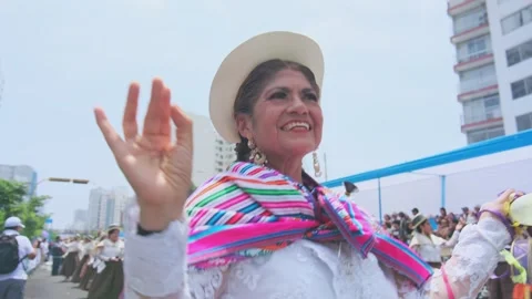 Lima, Peru. March, 1 2026; Peruvian women dancing in an andean carnival parade Stock Footage 330255423