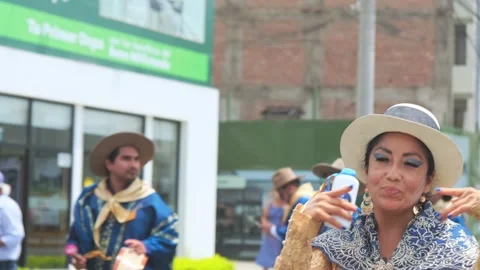 Lima, Peru. March, 1 2026; Peruvian woman dancing in an andean carnival parade Stock Footage 330255445