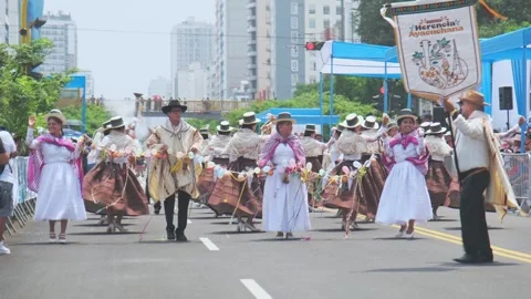 Lima, Peru. March, 1 2026; Traditional dancers performing at the andean carnival Stock Footage 330255466