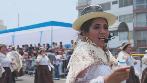 Lima, Peru. March, 1 2026; Peruvian women dancing in an andean carnival parade Stock Footage 330255512