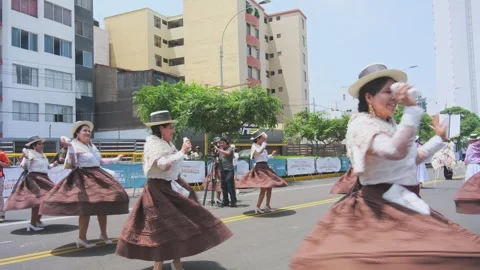 Lima, Peru. March, 1 2026; Andean carnival parade with dancers in lima, peru Stock Footage 330255523