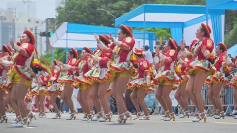 Lima, Peru. March, 1 2026; Peruvian women dancing in an andean carnival parade Stock Footage 330255799