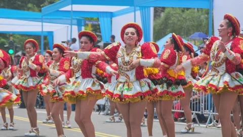 Lima, Peru. March, 1 2026; Peruvian women dancing in an andean carnival parade Stock Footage 330255851