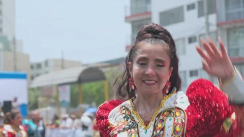 Lima, Peru. March, 1 2026; Andean women dancing in a carnival parade Stock Footage 330255988