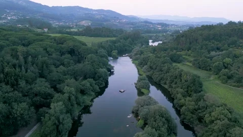 Lima River Through Ponte de Lima Village In Portugal. aerial pullback Stock Footage 248600104