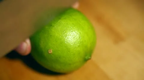 Lime 01: Cutting lime in half Stock Footage 8874016