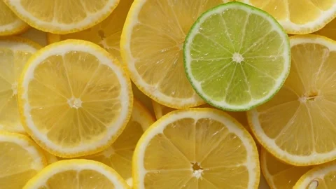Lime and lemon slices closeup, fruits background top view Stock Footage 308051883