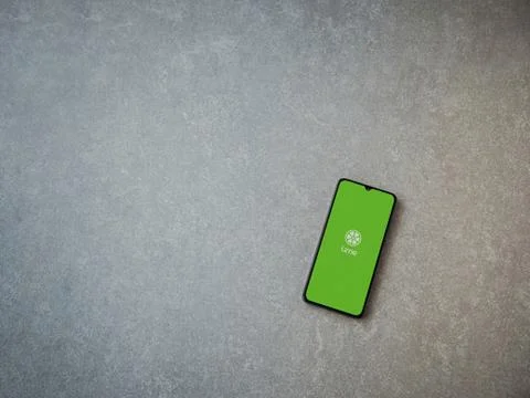 Lime app launch screen with logo on the display of a black mobile smartphone  Stock Photos