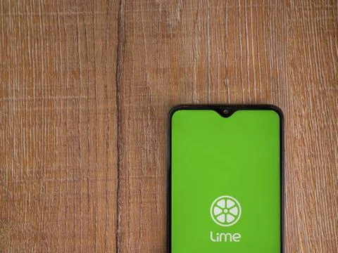 Lime app launch screen with logo on the display of a black mobile smartphone  Stock Photos