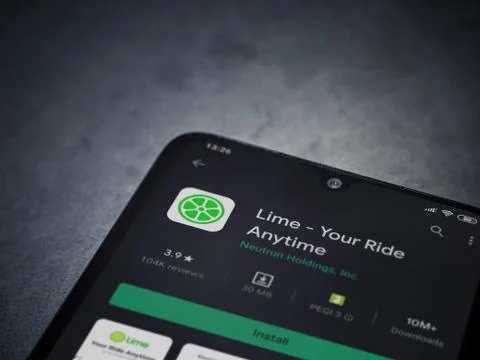 Lime app play store page on the display of a black mobile smartphone on dark  Stock Photos