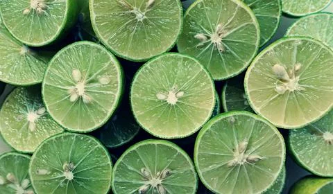 Lime Background with sun light from outside. Close up shot of limes. Stock Photos