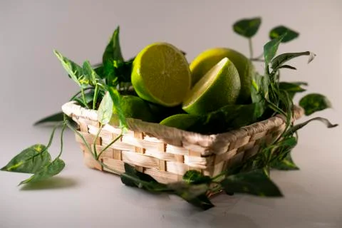 Lime in basket Stock Photos