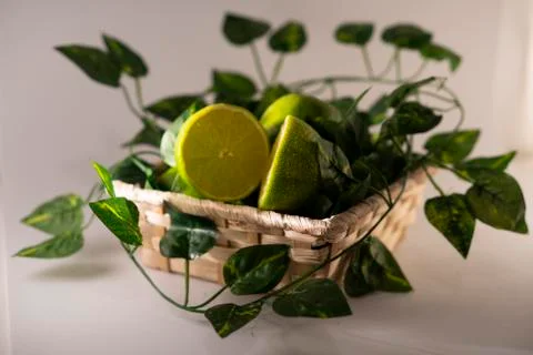 Lime in basket Stock Photos