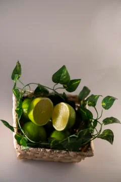 Lime in basket Stock Photos