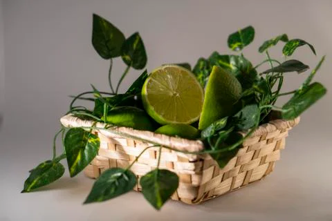 Lime in basket Stock Photos